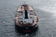 Oil retreats on oversupply worries