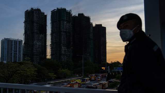 Hong Kong firefighters make final search for survivors after apartment tower blaze kills 94