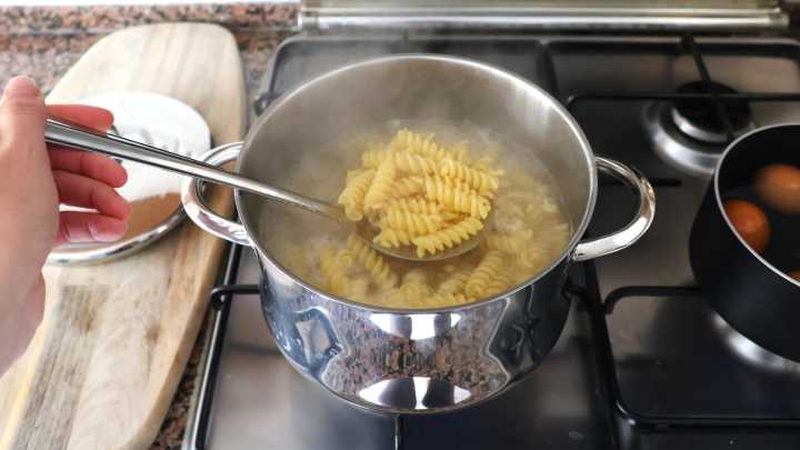 Why It's A Mistake To Cover The Pot While Cooking Pasta