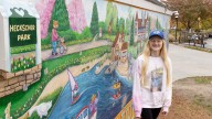 Splashes of Hope wraps Heckscher Park building in murals with a local touch