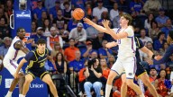 No. 10 Florida rolls Merrimack 80-45 as world's tallest teen scores first collegiate point