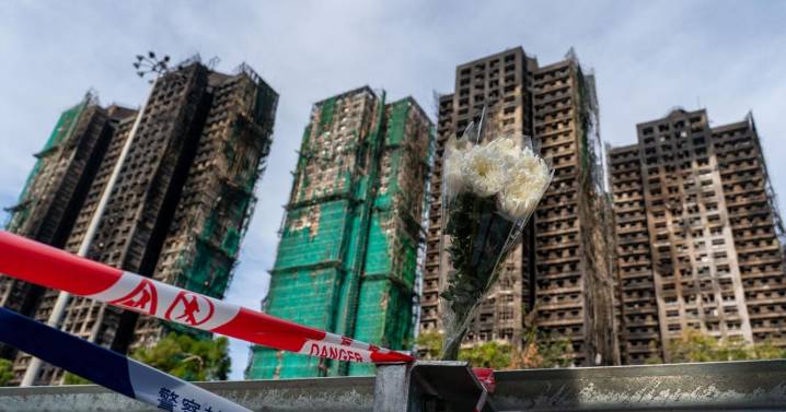 Eight more arrested over deadly Hong Kong blaze as toll rises to 128 with hundreds still missing