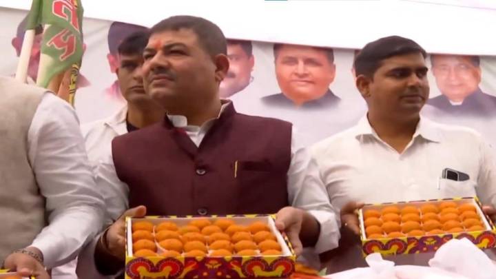 Janata Dal (United) supporters celebrate outside party office in Patna
