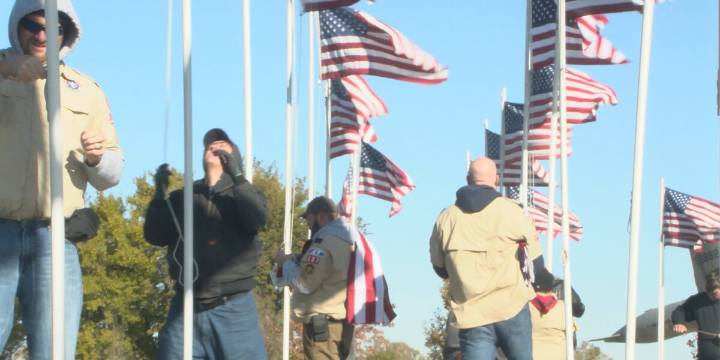 Grand Island Scouts raise flags at Hall County Veterans Park