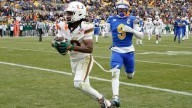 No. 13 Miami races past No. 24 Pitt 38-7 to state its case for a CFP berth