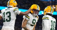 Love matches career high with 4 TD passes, lifting Packers over Lions