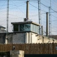 France catches one of two escapees in bed