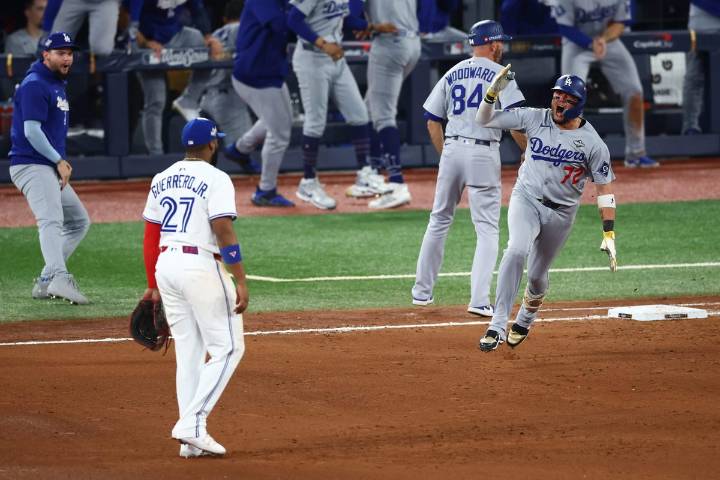 Miguel Rojas cements place in Dodgers' history: 'Biggest hit he's ever had in his life'