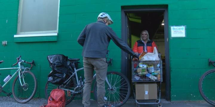 Local bicyclists deliver 300 pounds of food donations