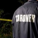 Coroner: Body found in wooded area