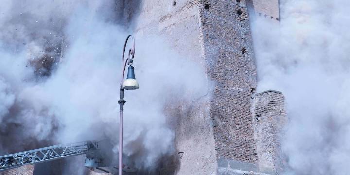 Medieval tower collapses, severely injuring a worker and trapping another