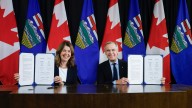 Canada's prime minister and Alberta's premier sign pipeline deal which could reverse oil tanker ban