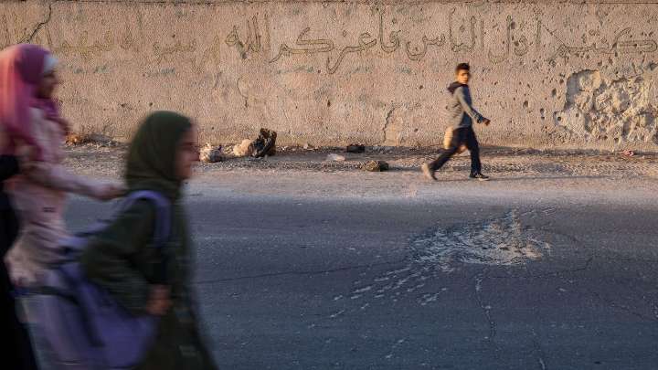 Syrian students return to schools stripped bare by conflict