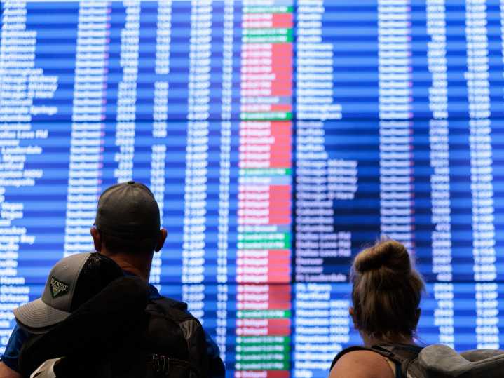 Mass delays and stranded travelers: Photos capture airport chaos amid the longest government shutdown in US history