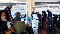 US travelers scramble to adjust as airlines cut 1,000 flights because of shutdown