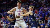 Gators' Rioux becomes tallest to play in college basketball game
