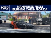 Two jump in to save Florida man from burning car