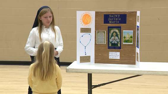 Students bring saints to life at St. James Living Wax Museum in Elizabethtown