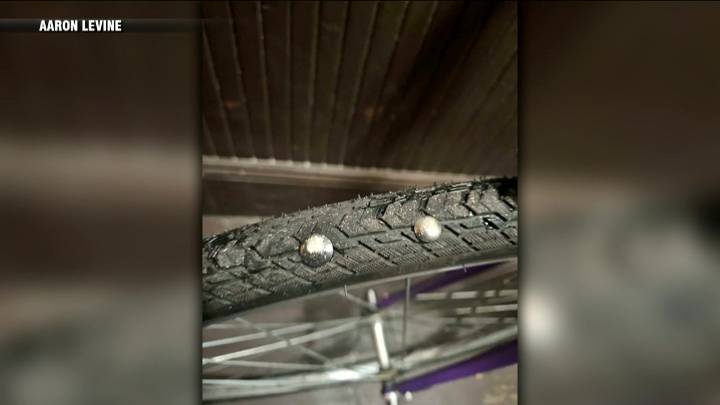 Police investigating after tacks scattered in Cambridge bike lane damaged several tires