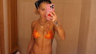 Guess the Sexy Singer Rockin' This Orange Bikini!