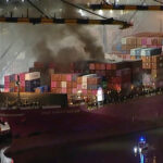 Dozens of firefighters battle blaze on container ship docked at LA port