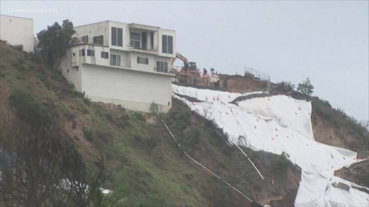 Atmospheric river hits Southern California with risks of flash floods and deaths on stormy seas