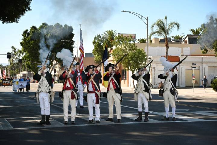 A Salute to Veterans Parade marches through downtown Riverside