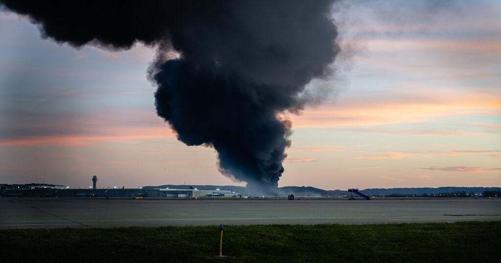 Officials scour charred site of Kentucky UPS plane crash for victims and answers