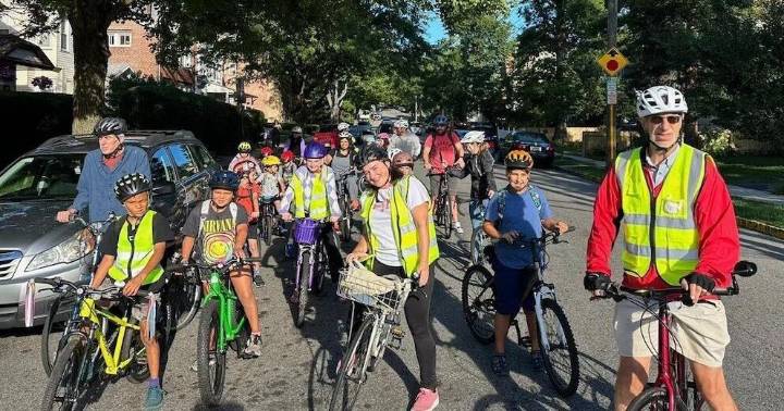 From a few to over 350, children and parents ride together to school as a 'bike bus'