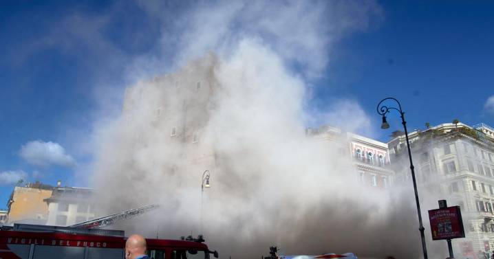 Rescuers work to reach worker trapped in medieval tower that partially collapsed in Rome
