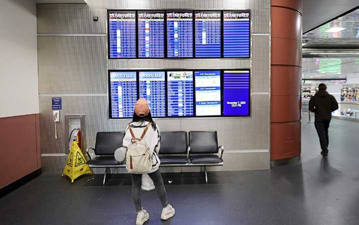 Airlines juggle flight cuts as shutdown hits air travel