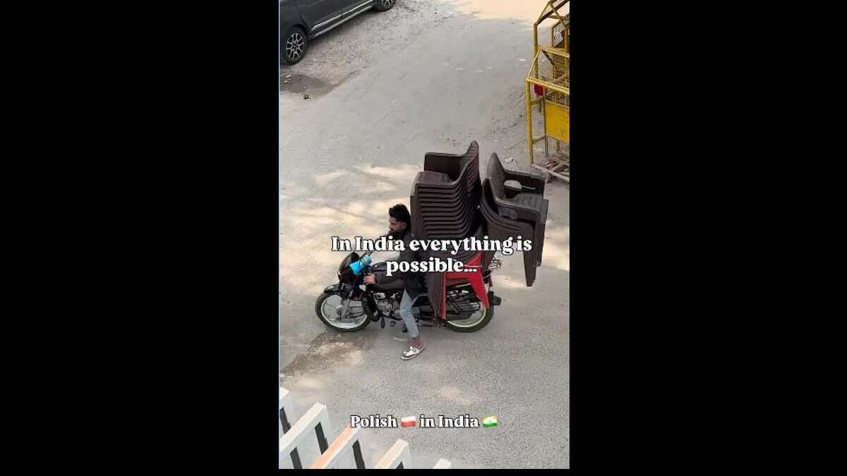 Indian man carries 20 chairs on bike, surprises Polish traveller