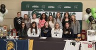 NATIONAL SIGNING DAY: Emma Sartin going from playing softball for Eastside Spartans to UNC Greensboro Spartans; Eastside student, travel-ball star Brooklyn Rutherford inks with Radford U. softball tea