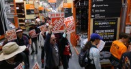 Day laborer organizers protest Home Depot, pressuring it to "scrape ICE out of their stores."