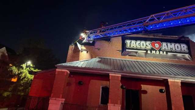 Firefighters work to put out restaurant fire in northwest Louisville