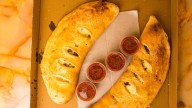How Does A Calzone Differ From A Stromboli?