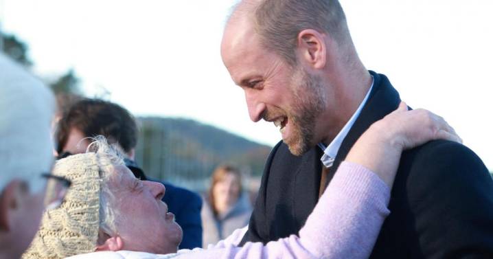 William hugged by well-wisher as he meets young marine conservationists