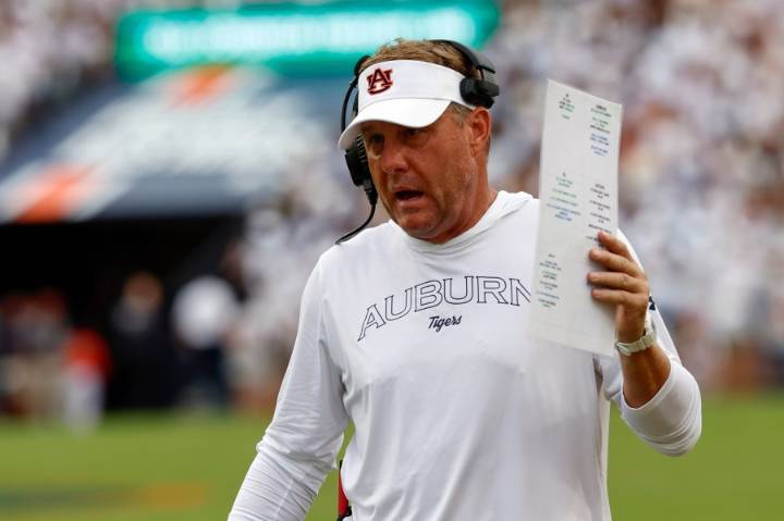 Auburn fans react after head football coach Hugh Freeze fired