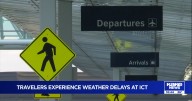 Holiday travelers experience delays and cancelations as winter storms hit upper Midwest