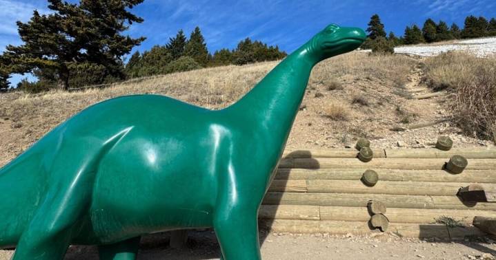'Is our dinosaur gone?' Iconic green Sinclair mascot takes a hike up Bozeman's 'M'