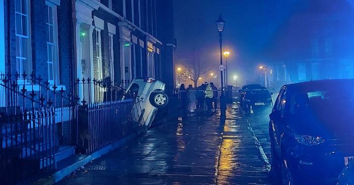 Horror car crash on UK city street sees vehicle trapped in extraordinary position
