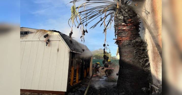 16 people displaced after fire spreads to apartment building, officials say