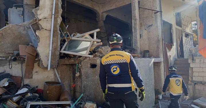 Israeli forces kill at least 13 people in southern Syria raid, officials and residents say