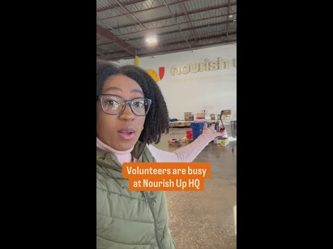 Food bank volunteers busy packing meals for Mecklenburg County families