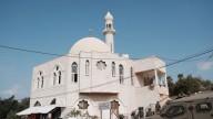 Israeli settlers torch mosque and spray graffiti in latest West Bank attack