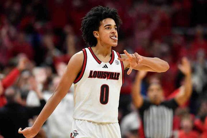 No. 12 Louisville holds off No. 9 Kentucky