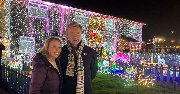 Torvill and Dean switch on Nuthall family's last Christmas lights display