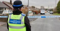 'Murder' probe as man found dead in quiet cul de sac and boy among five arrested