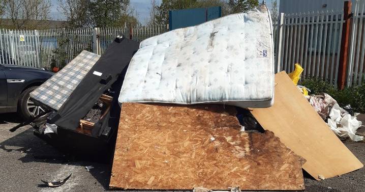 Fly-tipper dumped mattresses and sofas in a big pile along Cardiff road