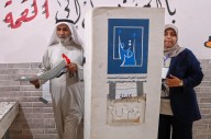 Iraqis vote in a parliamentary election marked by security, political boycott